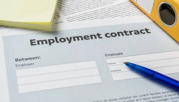 An Employment agreement with a pen on a desk — Stock Photo, Image