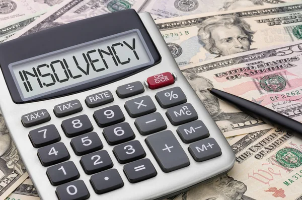 Calculator with dollar bills - Insolvency — Stock Photo, Image