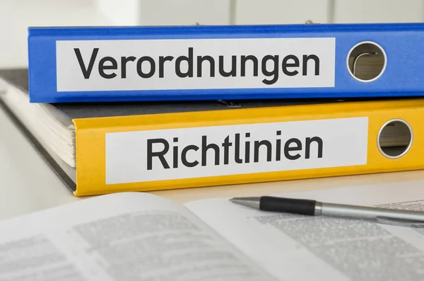 Folders with the label Regulations and Policies - Verordnungen u — Stock Photo, Image
