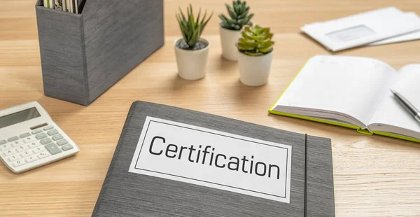 A folder on a desk with the label Certification — Stock Photo, Image