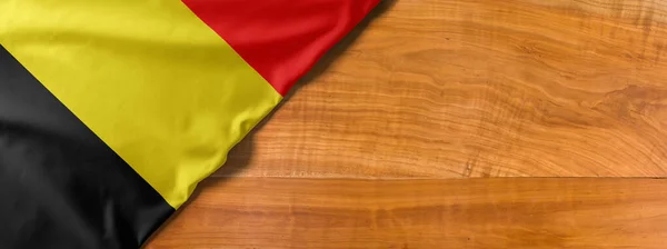 National flag of Belgium on a wooden background with copy space — 스톡 사진