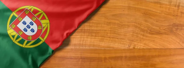 National flag of Portugal on a wooden background with copy space — 스톡 사진