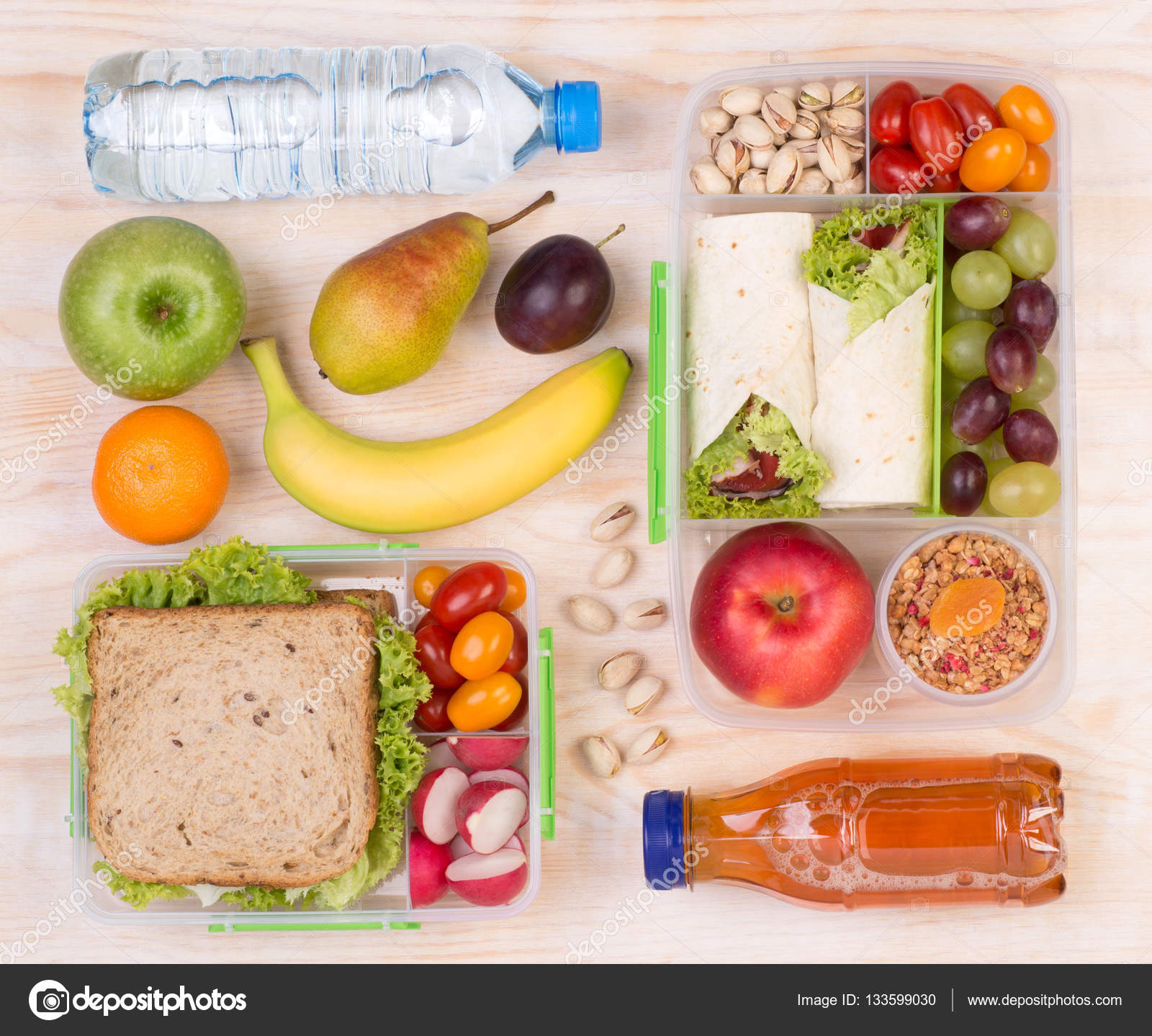 Food for lunch, lunchboxes with sandwiches, fruits, vegetables, and