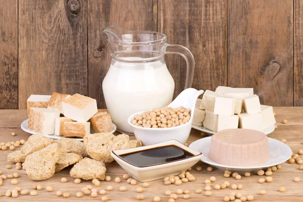 Soy products on wooden background