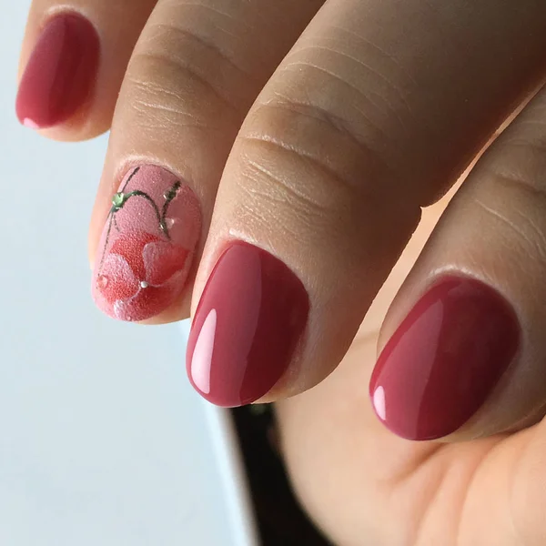 flower burgandy  nails for woman in beauty salon