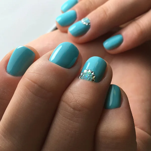 blue shine nails for woman in beauty salon