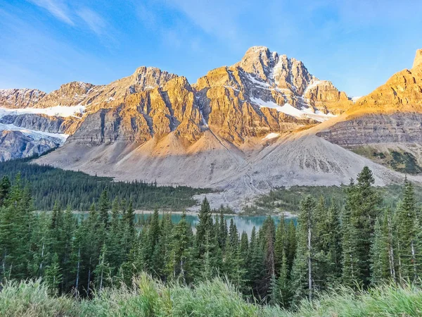 Canadian wilderness with rocky mountains at sunset