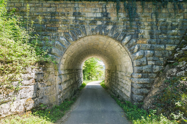 view through an old tunnel over which the train travels