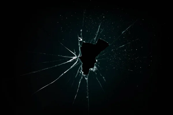 Broken and cracked glass with hole — Stock Photo, Image