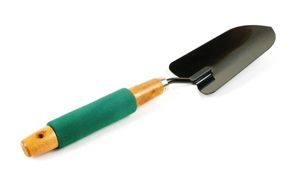 Black shovel with green handle — Stock Photo, Image