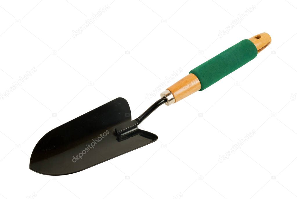 Black shovel with green handle