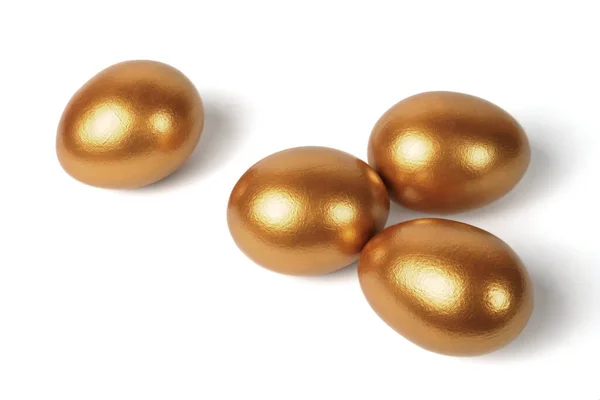 Golden eggs on a white background — Stock Photo, Image