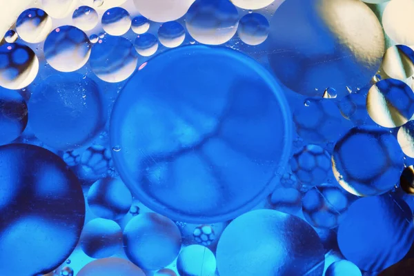 Colorful abstract background with gradient blue and white olors, oil drops in water abstract bubbles background
