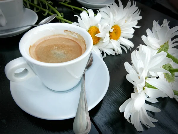 A cup of coffee in a cafe with friends