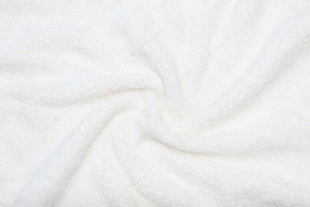 White beige delicate soft background of plush fabric.