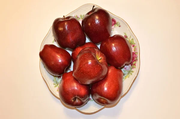 A dish of fruit. Very ripe red apples. this dish is a dream of vegan. Even an image with these fruits causes salivation. they so ask, give up fast food and eat us ....
