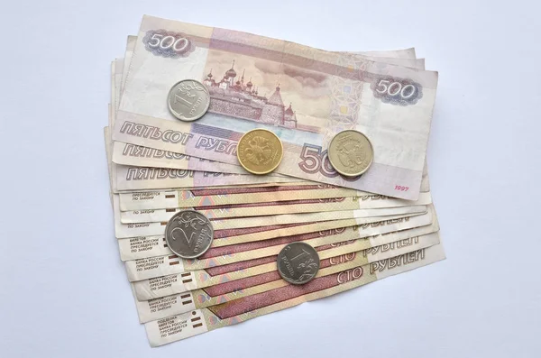 The photo can be called `try to live up to the salary`, I hope that this image will attract only large bills that are missing on it. The photo shows bills and coins in circulation in Russia