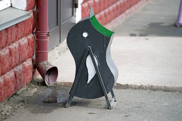 Street trash in the form of a penguin.