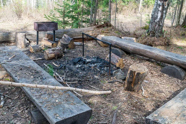 Playground in the forest. Benches, BBQ and fireplace for relaxing in the forest