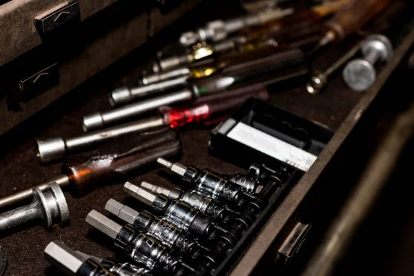 Tool box drawer with hex sockets, nut drivers, and various tools