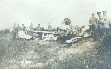 German soldiers inspecting wreck of British triple-plane clipart