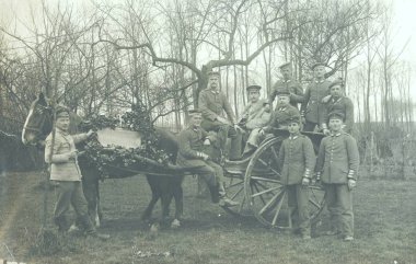 German soldiers in one horse waggon posing at camera clipart