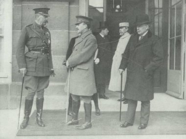 British officers and David Lloyd George infront of Versailles clipart