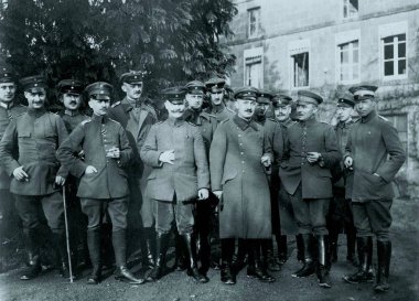 Group of german officers posing in front of building clipart