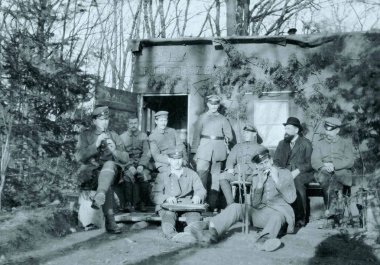german soldiers and civilian sitting in front of shelter clipart