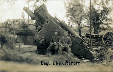Two german soldiers posing in front of british 10 inch mortar clipart
