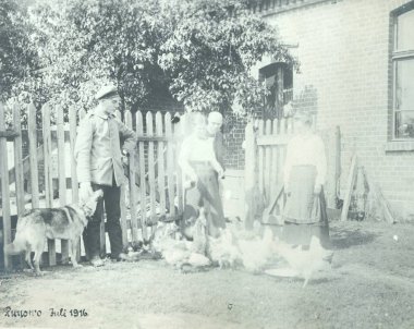 german soldier with civilians, dog and chickens at house court, Runow clipart