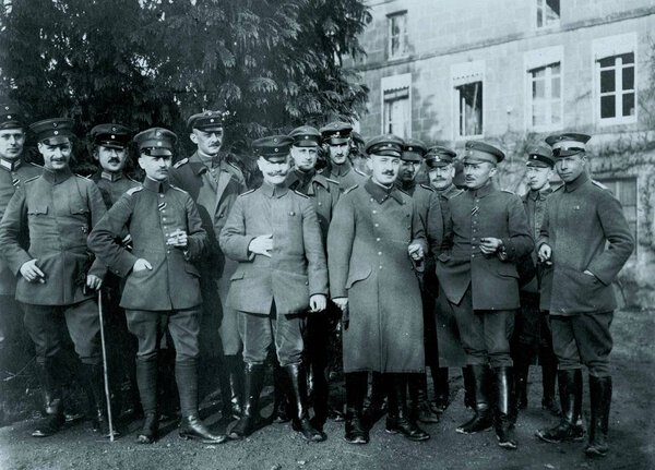 Group of german officers posing in front of building