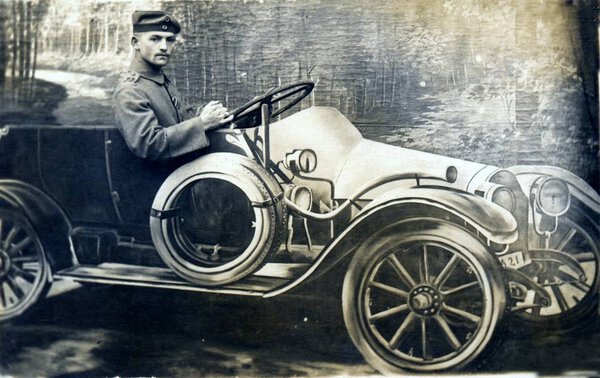 german soldier in car posing at camera in studio