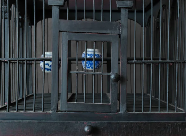 Vintage and Old Wooden Bird Cage with Water Cups