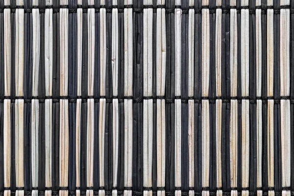 Чёрно-коричневые Соломенные коврики — стоковое фото