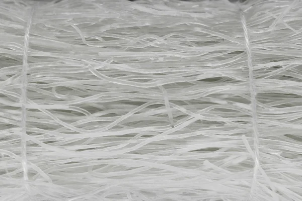 Witte rijstnoedels gebonden met Wit touw achtergrond oppervlak — Stockfoto