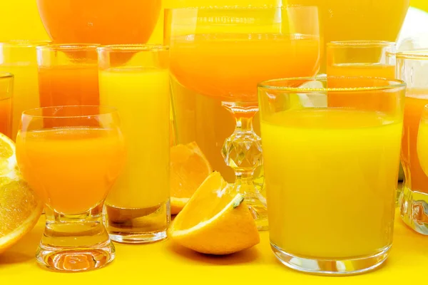 Juice in various shape glasses — Stock Photo, Image