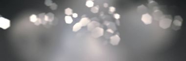 Gerçekçi kedi göz bokeh ile geometrik altıgen Iris. Yumuşak hafif pembe arka plan odağını ışık parçacıkları ile. Uzun yatay biçimi.