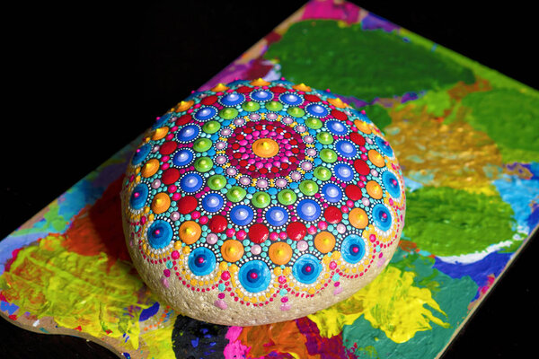 mandala painted on a stone