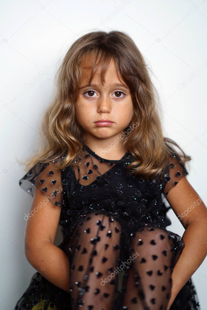 4 year old Italian girl looks straight