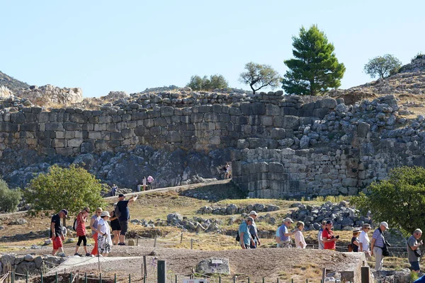 Mycenae, Greece, October 05 2019 Tourists of various nationalities visiting the archaeological