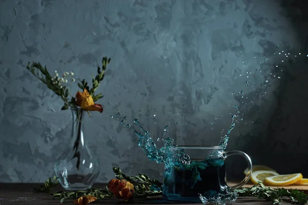 Still Life Table Tea Flowers Fly Spray Water — Stock Photo, Image