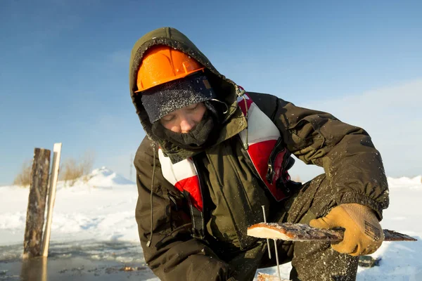 Worker collects formwork for the ice hole — Stock Image Worker collects formwork for the ice hole Royalty Free Stock Photos