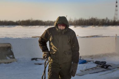 Portrait of a builder with steel tongs and hands