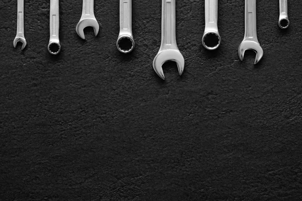 Wrenches Black Textured Background — Stock Photo, Image