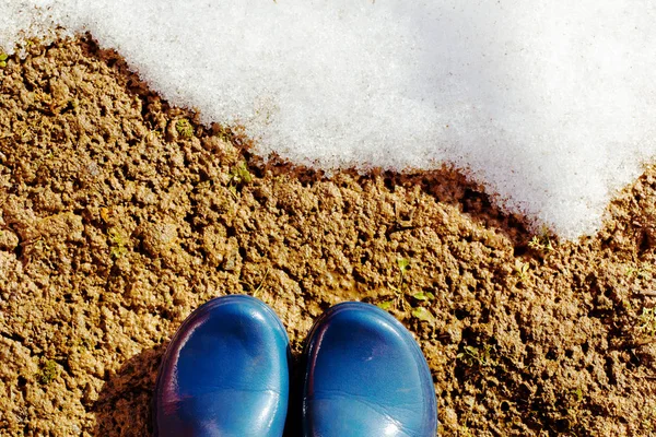 Blue Rubber Boots Wet Ground Front Melting Snow Sunny Day — Stock Photo, Image