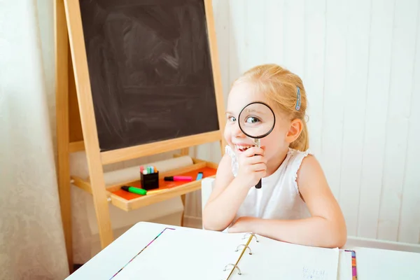 Child with Book and Magnifying Glass, School Kid Education, Happy pupil girl with Magnifier
