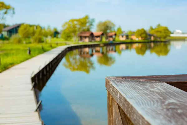 An empty fishing pier in a country hotel. Concept of the epidemic Covid-19. Self-isolation, the collapse of the business. Blurred background.