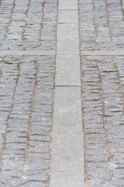 Brukowanie kamieni na moście ulicy w centrum miasta — Zdjęcie stockowe