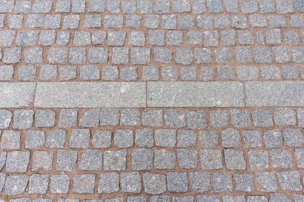 Pedras de pavimentação na rua ponte no centro da cidade — Fotografia de Stock